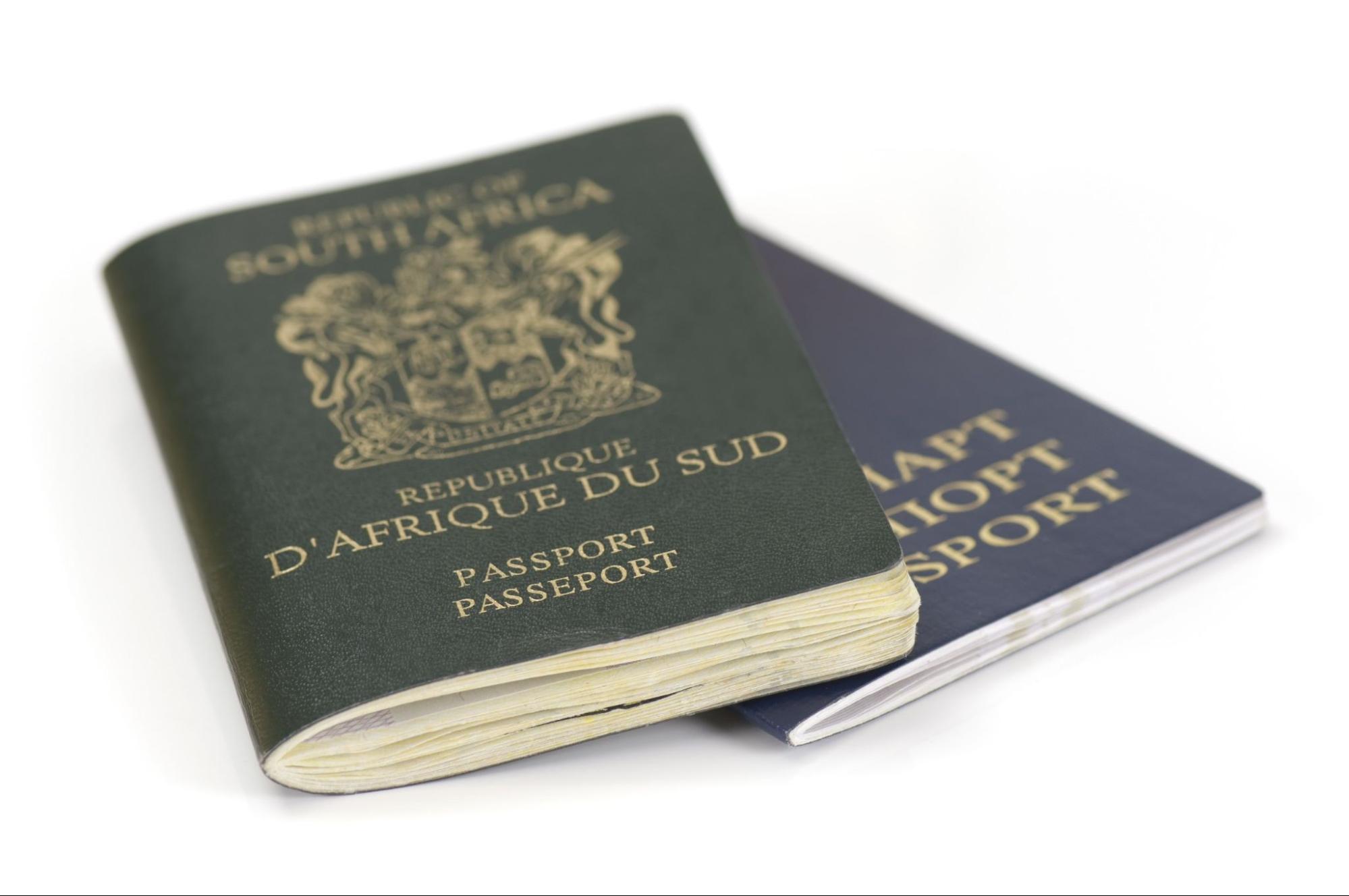South African and Belarussian Passport on white background